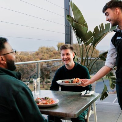 Luke serving two guests on The Terrace